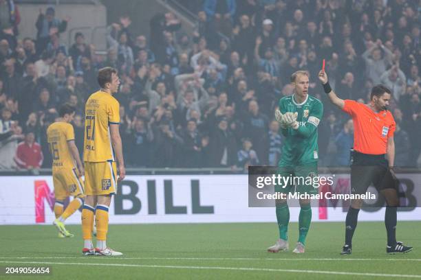 Adam Carlen of IFK Goteborg is shown a red card by referee Joakim Ostling during the Svenska Cupen Group 4 match between Djurgardens IF and IFK...