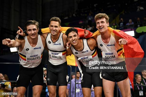 Belgium's Christian Iguacel, Dylan Boloree, Jonathan Saccor and Belgium's Alexander Doom celebrate after winning the Men's 4x400m relay final during...