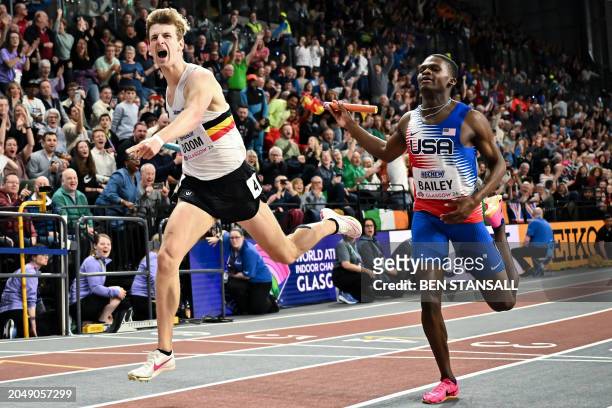 Belgium's Alexander Doom crosses the finish line past USA's Christopher Bailey to win the Men's 4x400m relay final during the Indoor World Athletics...