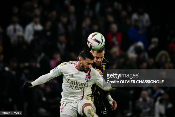 Lyon's Algerian forward Said Benrahma fights for the ball with Lens' French defender Jonathan Gradit during the French L1 football match between...