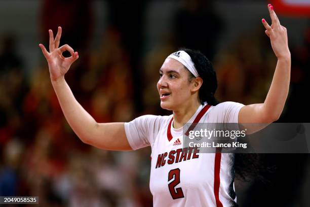 Mimi Collins of the NC State Wolfpack reacts following a three-point basket during the second half of the game against the Wake Forest Demon Deacons...