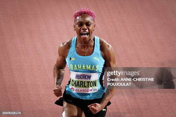 First-placed Bahamas' Devynne Charlton celebrates after winning the Women's 60m hurdles final during the Indoor World Athletics Championships in...