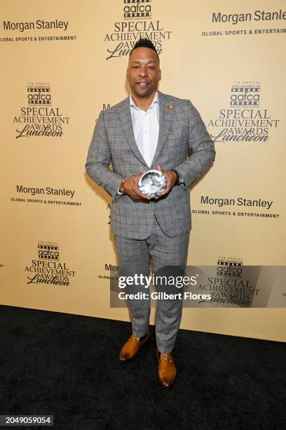 Deon Taylor poses with the Horizon Award at the AAFCA Special Achievement Awards Luncheon held at the Los Angeles Athletic Club on March 3, 2024 in...