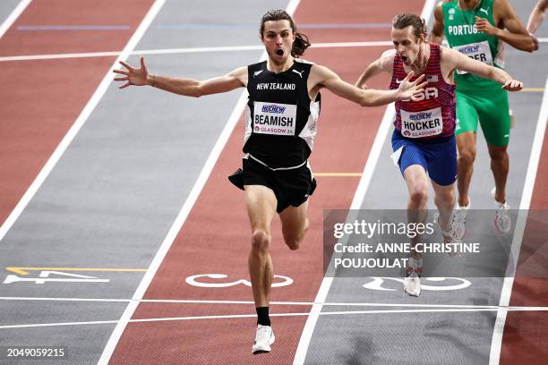 First-placed New Zealand's Geordie Beamish celebrates as he crosses the finish line in the Men's 1500m final during the Indoor World Athletics...