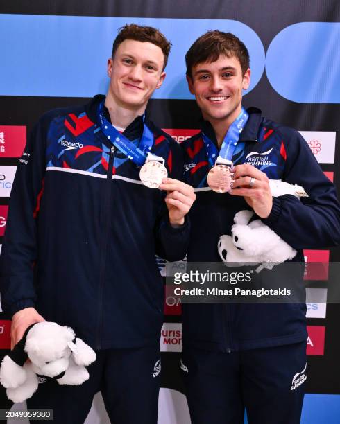 Noah Williams and teammate Thomas Daley of Great Britain pose with their bronze medals after finishing third in the Men's 10m Synchronized Platform...
