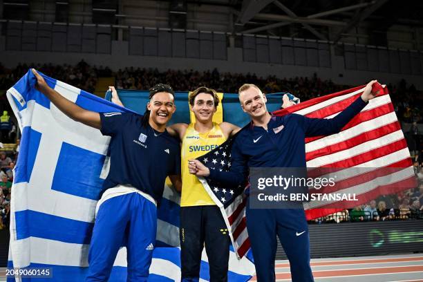 Third-placed Greece's Emmanouil Karalis, first-placed Sweden's Armand Duplantis and second-placed USA's Sam Kendricks celebrate after competing in...