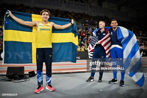 First-placed Sweden's Armand Duplantis, second-placed USA's Sam Kendricks and third-placed Greece's Emmanouil Karalis celebrate after competing in...