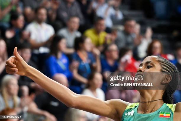 First-placed Ethiopia's Freweyni Hailu celebrates as she crosses the finish line to win the Women's 1500m final during the Indoor World Athletics...