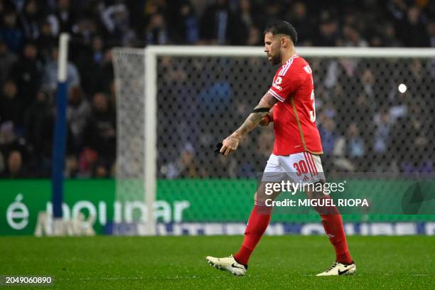 Benfica's Argentinian defender Nicolas Otamendi leaves the pitch after being presented a second yellow card during the Portuguese League football...