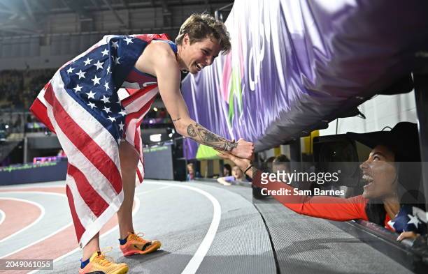 Scotland , United Kingdom - 3 March 2024; Nikki Hiltz of USA is congratulated on winning silver in the Women's 1500m Final by her teammate, Long Jump...