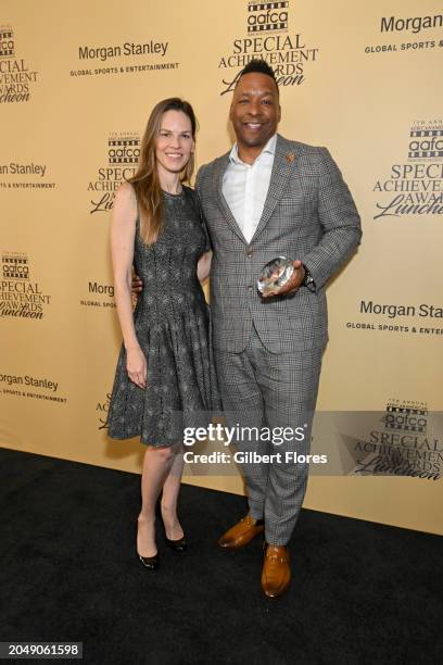 Hilary Swank and Deon Taylor pose with the Horizon Award at the AAFCA Special Achievement Awards Luncheon held at the Los Angeles Athletic Club on...