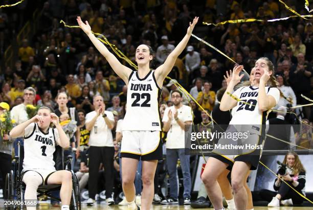 Guard Caitlin Clark and guard Kate Martin of the Iowa Hawkeyes celebrates in the confetti after senior day festivities after the match-up against the...