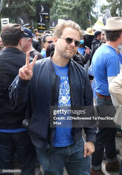 Adam Conover is seen at a rally in support of the International Alliance of Theatrical Stage Employees on March 03, 2024 at Woodman Park in Encino,...