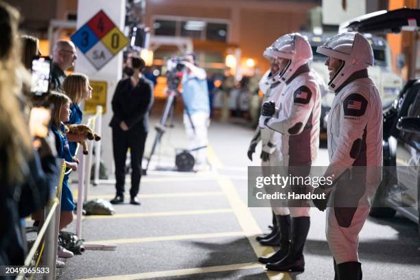 In this handout photo provided by NASA, Russian cosmonaut and Mission Specialist Alexander Grebenkin, Mission Specialist Jeanette Epps, Commander...