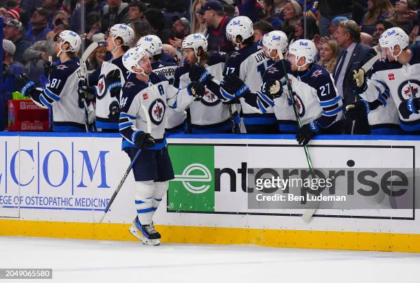 Josh Morrissey of the Winnipeg Jets celebrates after a goal during the third period of an NHL game against the Buffalo Sabres on March 3, 2024 at...