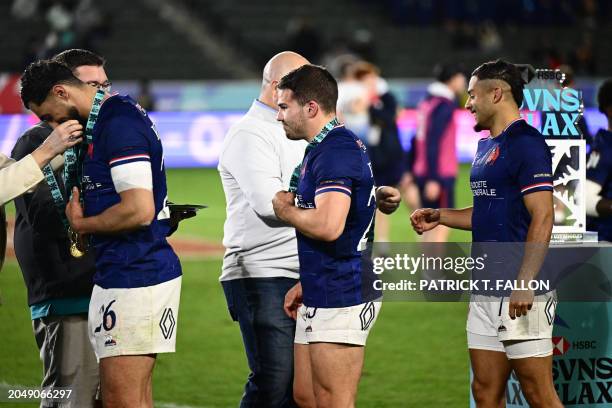 France's Antoine Dupont and teammates receive their medals after winning the 2024 HSBC Rugby Sevens Los Angeles tournament final men's match against...