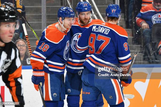 Zach Hyman of the Edmonton Oilers celebrates his second-period goal against the Pittsburgh Penguins with teammates Leon Draisaitl and Connor McDavid...