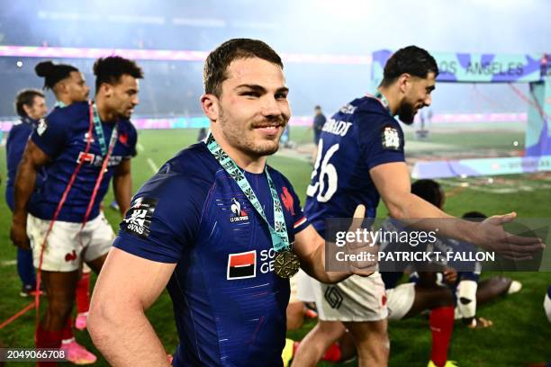 France's Antoine Dupont and teammates celebrate after winning the 2024 HSBC Rugby Sevens Los Angeles tournament final men's match against Great...