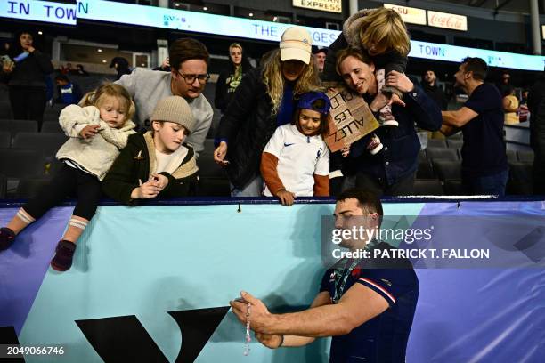 France's Antoine Dupont greets fans after France won the 2024 HSBC Rugby Sevens Los Angeles tournament final men's match against Great Britain at...