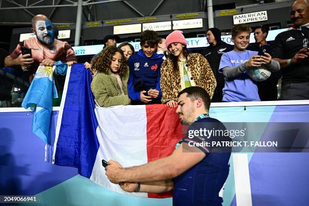 France's Antoine Dupont greets fans after France won the 2024 HSBC Rugby Sevens Los Angeles tournament final men's match against Great Britain at...