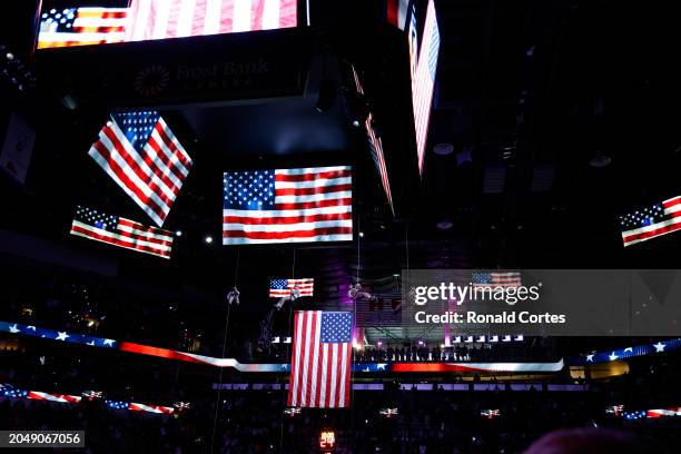 Paratroopers hang from the ceiling for Military Appreciation day before the start of the San Antonio Spurs against the Indiana Pacers at Frost Bank...