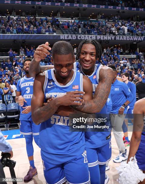 David Jones and Jaykwon Walton of the Memphis Tigers celebrate after defeating the UAB Blazers on March 3, 2024 at FedExForum in Memphis, Tennessee.