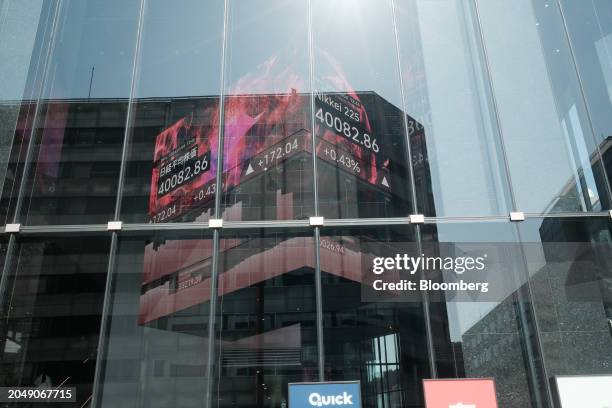 An electronic stock board showing the Nikkei 225 Stock Average inside a securities firm in Tokyo, Japan, on Monday, March 4, 2024. Japan's Nikkei 225...