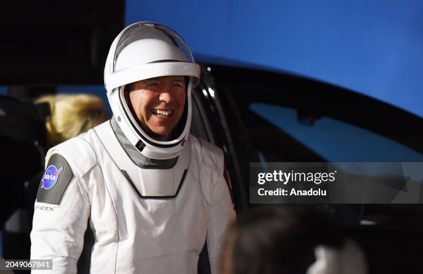 Crew 8 NASA astronaut and pilot Michael Barratt greets family members after walking out of the Neil Armstrong Operations and Checkout Building before...