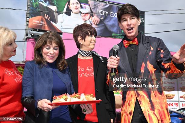 Actress Kate Linder, songwriter Diane Warren and BJ Korros attend a ceremony naming a vegan hot dog after Warren at Pink's Hot Dogs on February 29,...