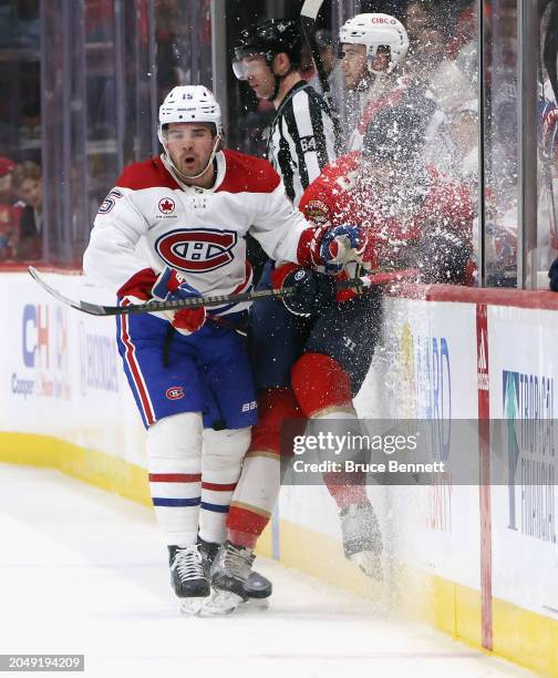 Alex Newhook of the Montreal Canadiens checks Aaron Ekblad of the Florida Panthers during the first period at Amerant Bank Arena on February 29, 2024...