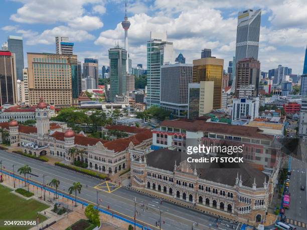 aerial view drone many tourists visit merdeka square and sultan abdul samad building, kuala lumpur, malaysia. - abdul stock pictures, royalty-free photos & images