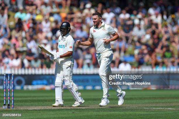 Josh Hazlewood of Australia celebrates after taking the wicket of Rachin Ravindra of New Zealand during day two of the First Test in the series...