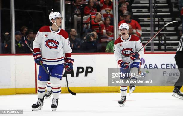 Juraj Slafkovsky of the Montreal Canadiens scores with .7 seconds left in the second period against the Florida Panthers and is joined by Cole...