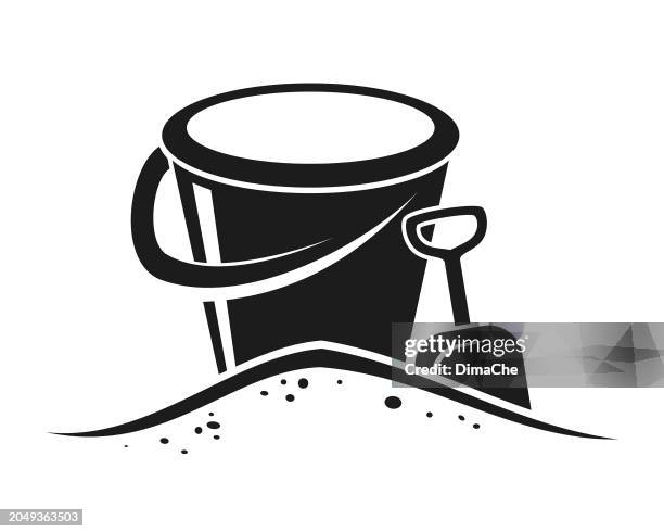 bucket with handle and shovel in sand - cut out vector icon silhouette - sand bucket stock illustrations