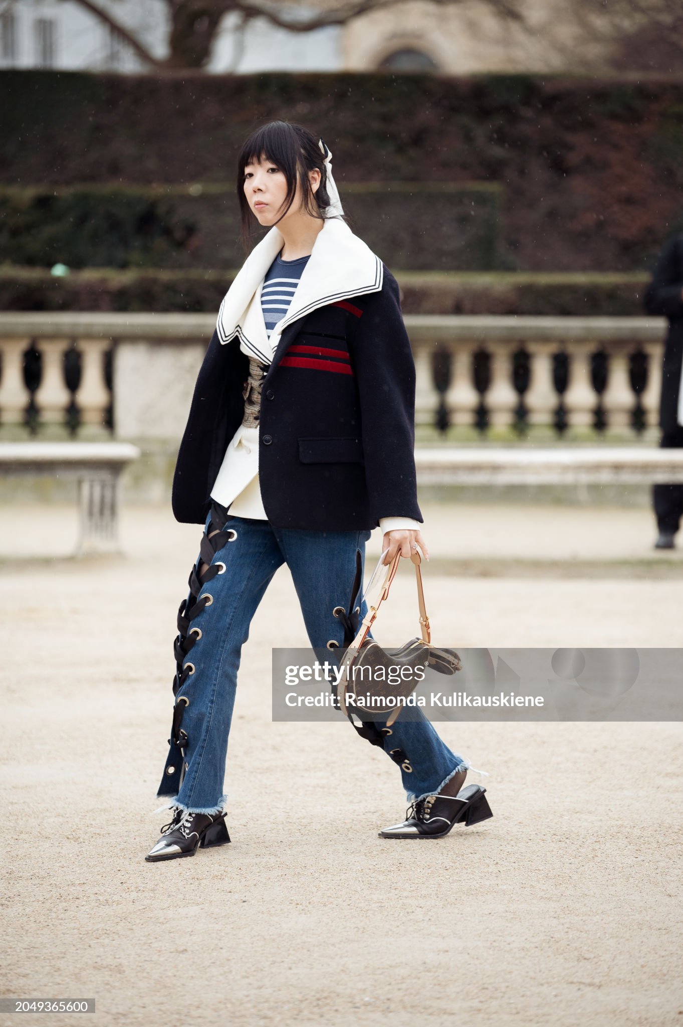 paris-france-susie-lau-wears-blue-jeans-with-ties-blue-and-white-top-black-white-and-red.jpg