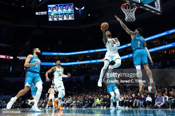 Damian Lillard of the Milwaukee Bucks attempts a lay up against Miles Bridges of the Charlotte Hornets during the second half of the game at Spectrum...