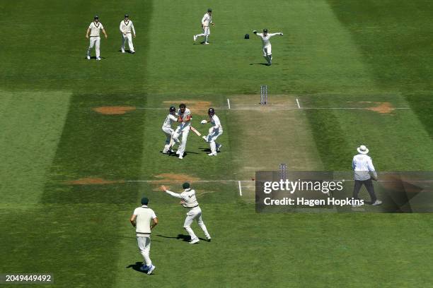 Kane Williamson of New Zealand collides with Will Young before being run out during day two of the First Test in the series between New Zealand and...