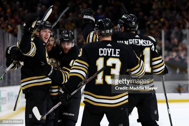 Mason Lohrei of the Boston Bruins celebrates with Kevin Shattenkirk, Pavel Zacha, Charlie Coyle, and James van Riemsdyk after scoring the game...