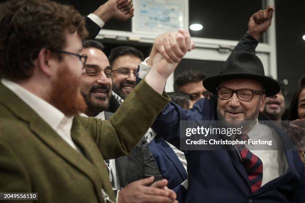 Workers Party of Britain candidate George Galloway celebrates with supporters at his campaign headquarters after being declared the winner in the...