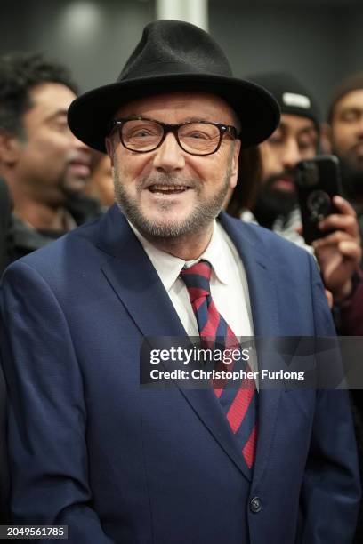 Workers Party of Britain candidate George Galloway celebrates with supporters at his campaign headquarters after being declared the winner in the...