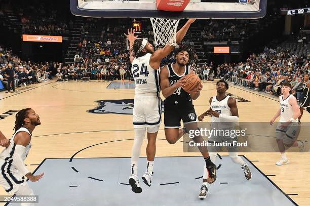 Cam Thomas of the Brooklyn Nets goes to the basket against Lamar Stevens of the Memphis Grizzlies during the game at FedExForum on February 26, 2024...