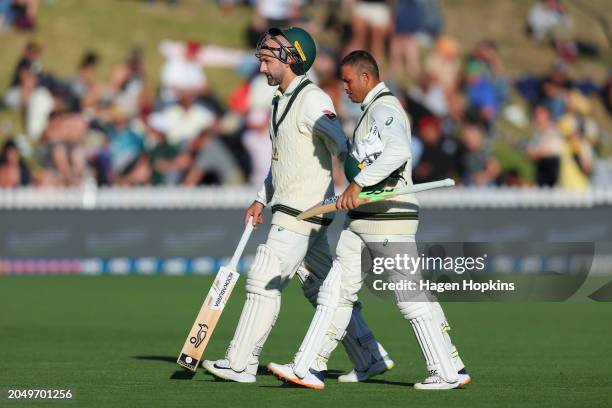 Nathan Lyon and Usman Khawaja of Australia leave the field at stumpsduring day two of the First Test in the series between New Zealand and Australia...