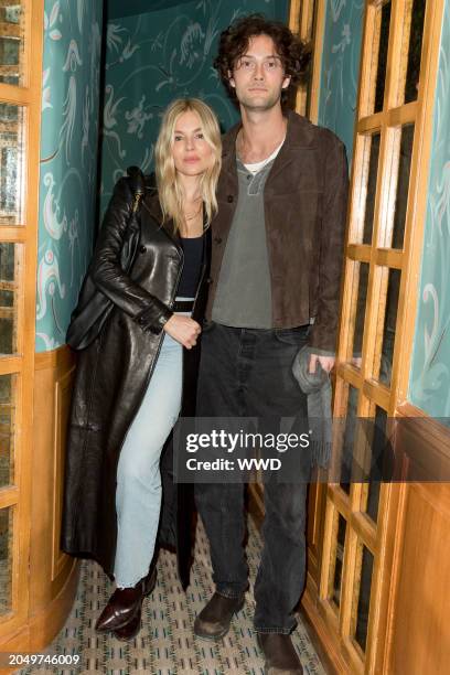 Sienna Miller and Oli Green at the Frame Dinner as part of Paris Ready to Wear Fashion Week at Caviar Kaspia on March 3, 2024 in Paris, France.