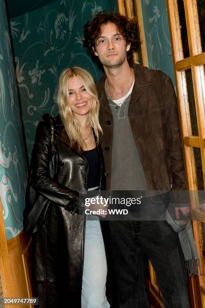 Sienna Miller and Oli Green at the Frame Dinner as part of Paris Ready to Wear Fashion Week at Caviar Kaspia on March 3, 2024 in Paris, France.