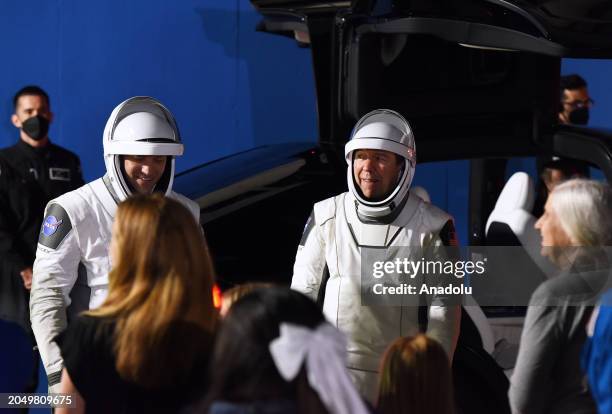 Crew 8 commander Matthew Dominick and pilot Michael Barratt greet family members and friends after walking out of the Neil Armstrong Operations and...