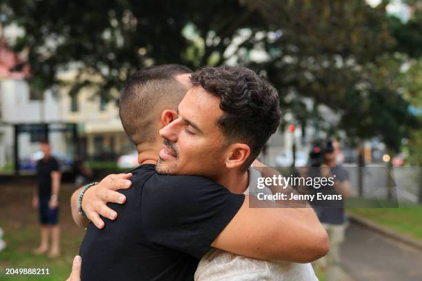People hug on arrival at a community vigil in Darlinghurst on March 01, 2024 in Sydney, Australia. The bodies of alleged murder victims Jesse Baird...