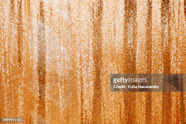 background with gold sequins. full frame, defocus. - gold sequin dress stock pictures, royalty-free photos & images