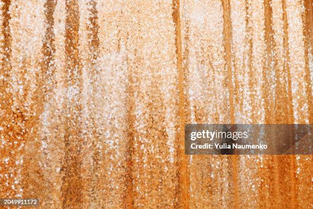 background with gold sequins. full frame, defocus. - gold sequin dress stock pictures, royalty-free photos & images