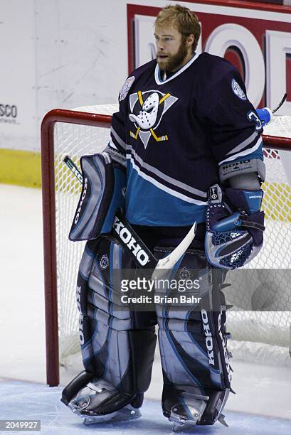 Jean-Sebastien Giguere of the Mighty Ducks of Anaheim looks on against the New Jersey Devils in game one of the 2003 Stanley Cup Finals at...