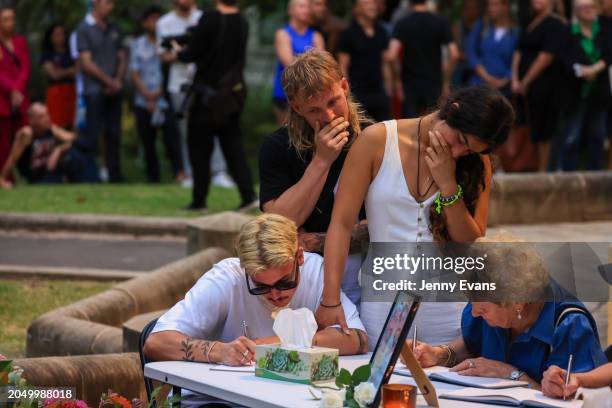 People sign the condolence book in honour of Jesse Baird and Luke Davies during a public vigil at Green Park on March 01, 2024 in Sydney, Australia....